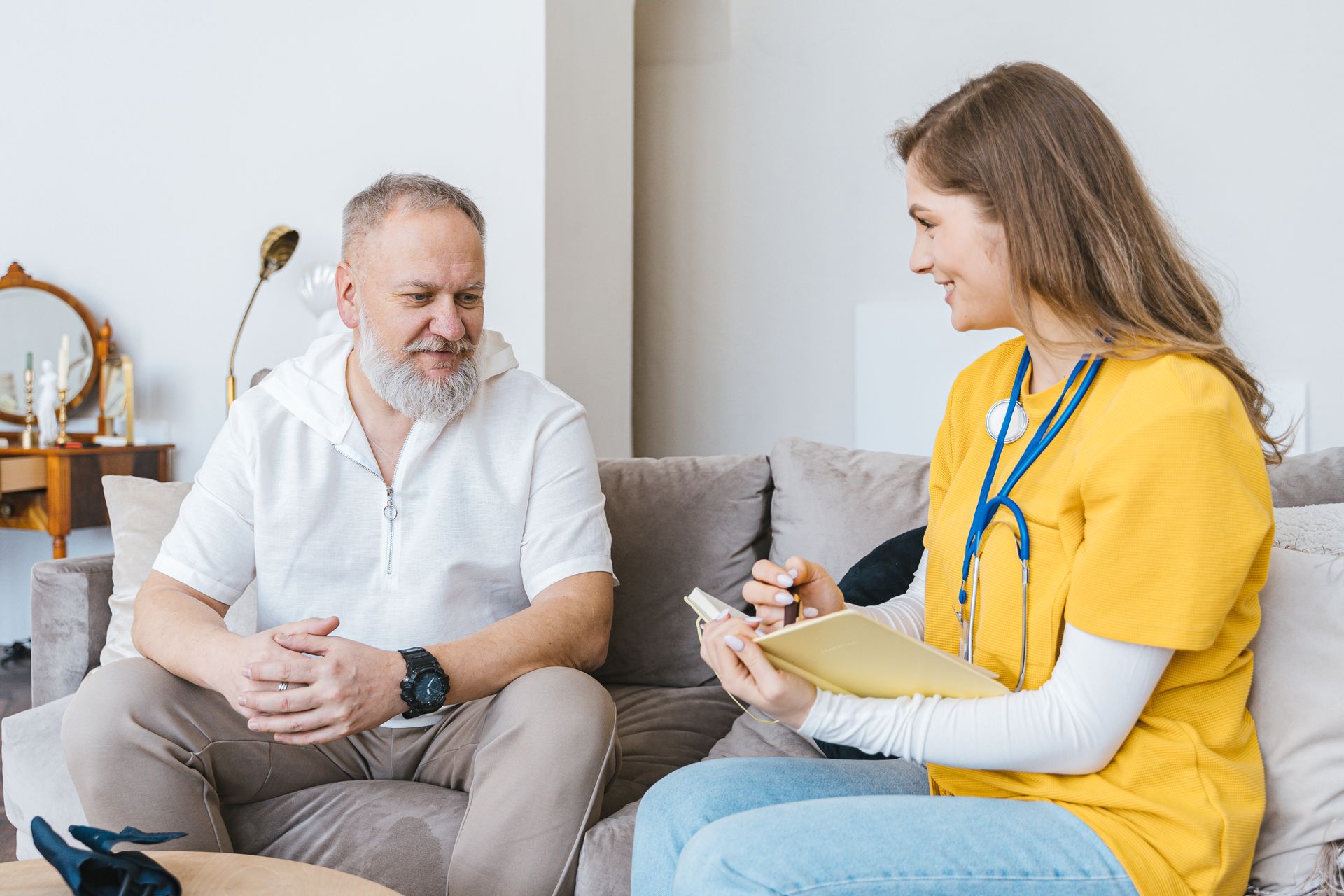 Care worker supporting a patient