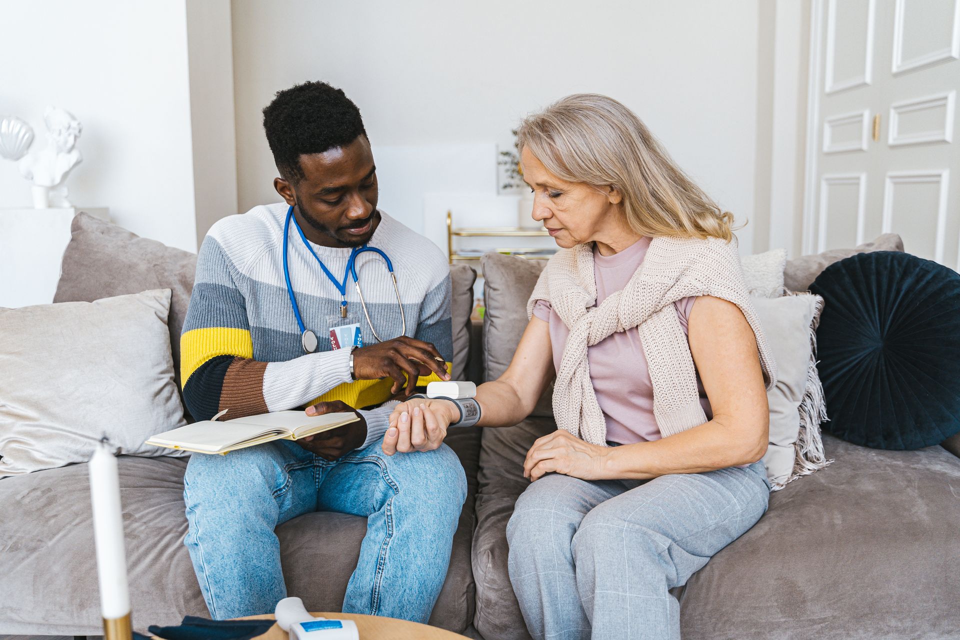 Care worker checking a patient's blood pressure